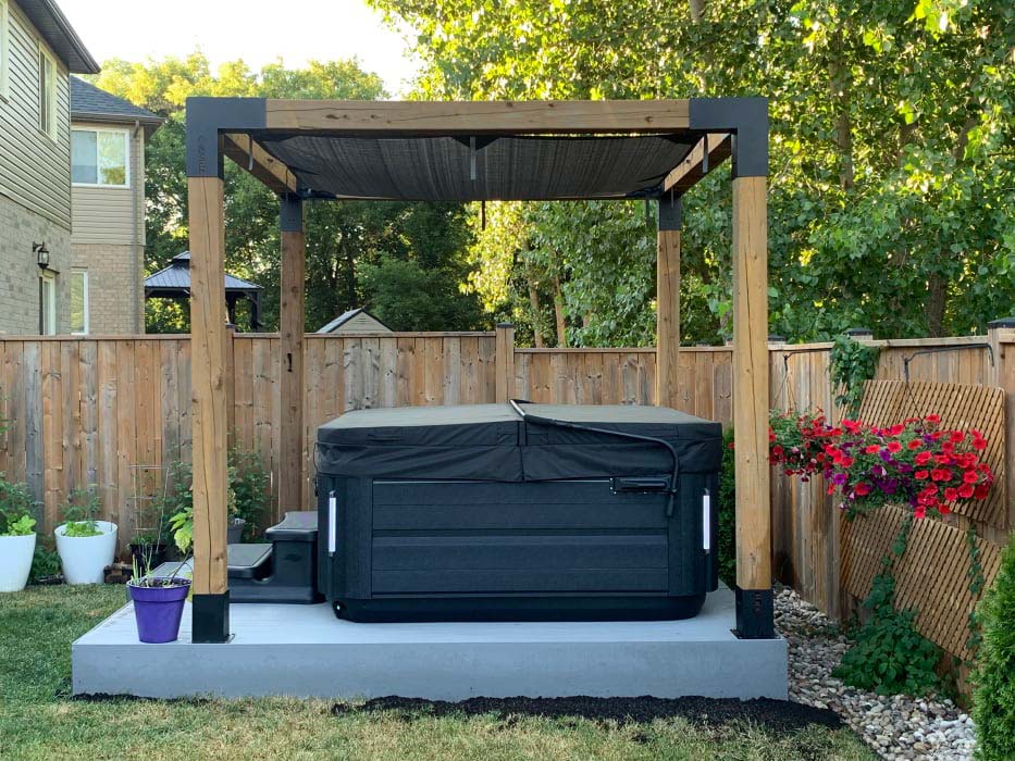 Hot tub in backyard with cover
