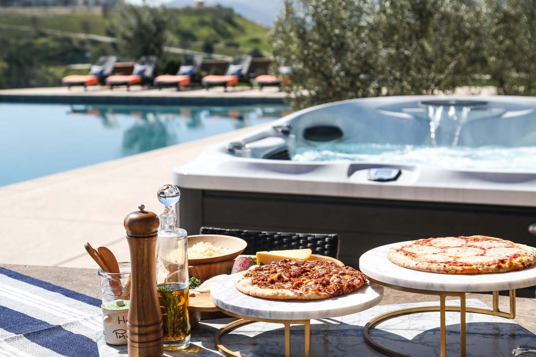 Hot tub next to the pool and snacks