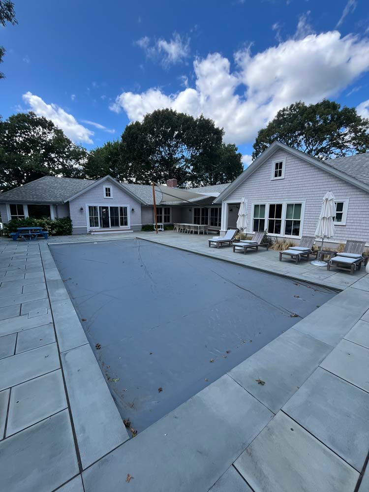 Pool with cover in back yard
