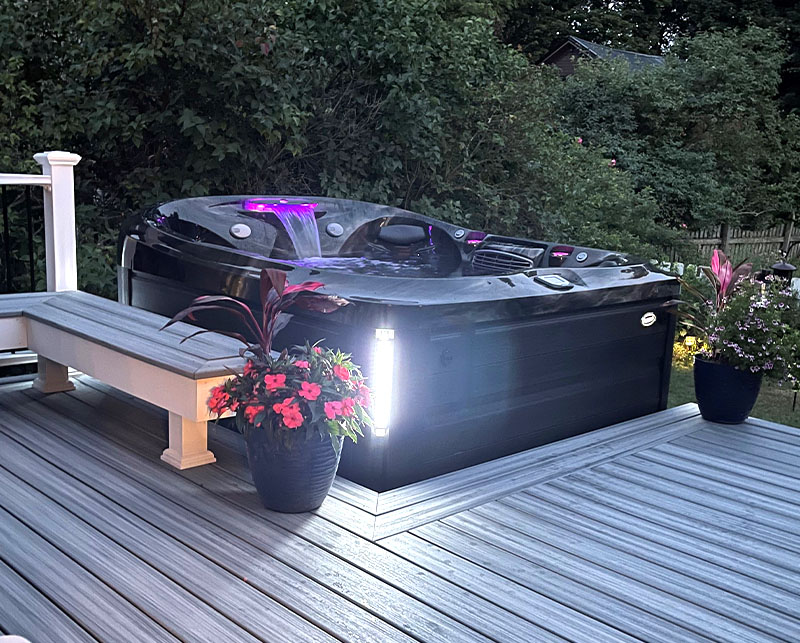 Hot tub in backyard at night