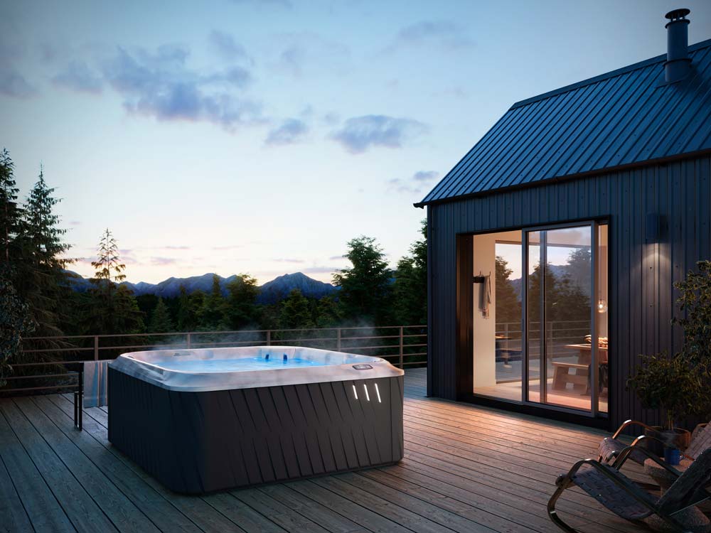 Hot tub outside cabin at night