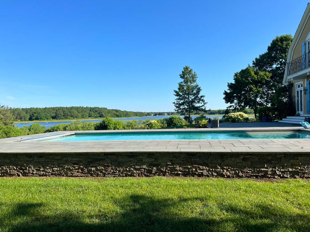 Pool in backyard next to the river