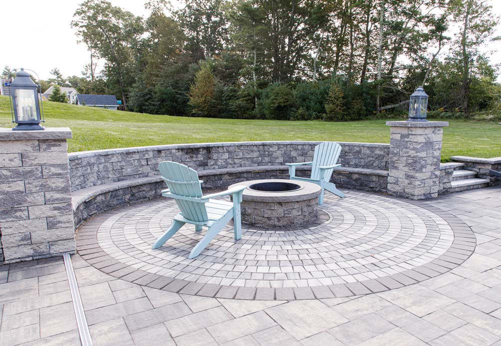New fire pit next to the pool in beautiful backyard