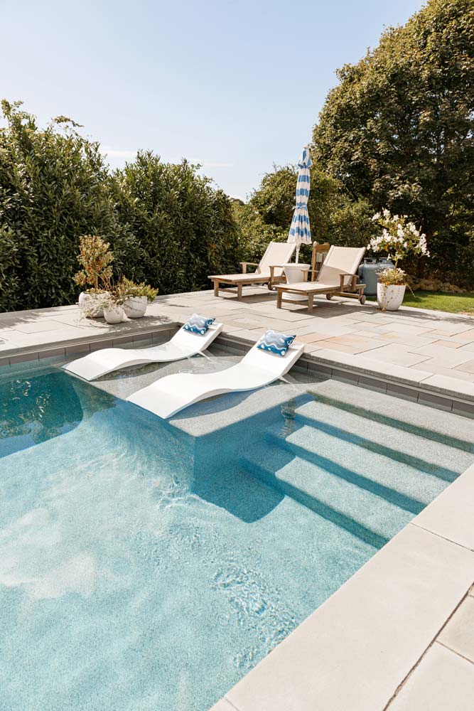 New pool with steps and a tanning ledge on the side