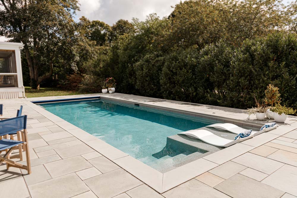 New pool with steps and a tanning ledge on the side