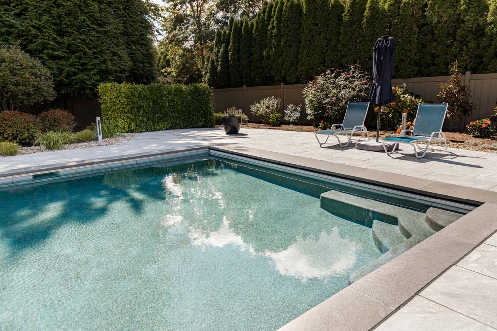 New beautiful gunite pool with steps in backyard